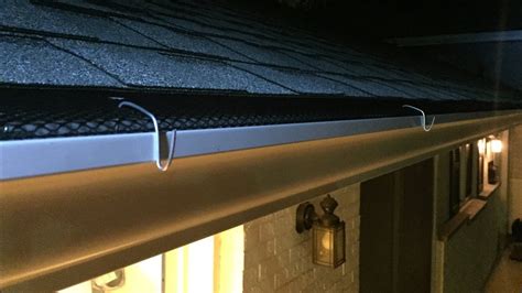 install christmas lights bottom of gutter metal bracket|gutter lights with gutter guards.